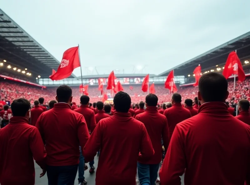 Exterior view of Anfield stadium, the home of Liverpool Football Club, on a match day with fans streaming in.