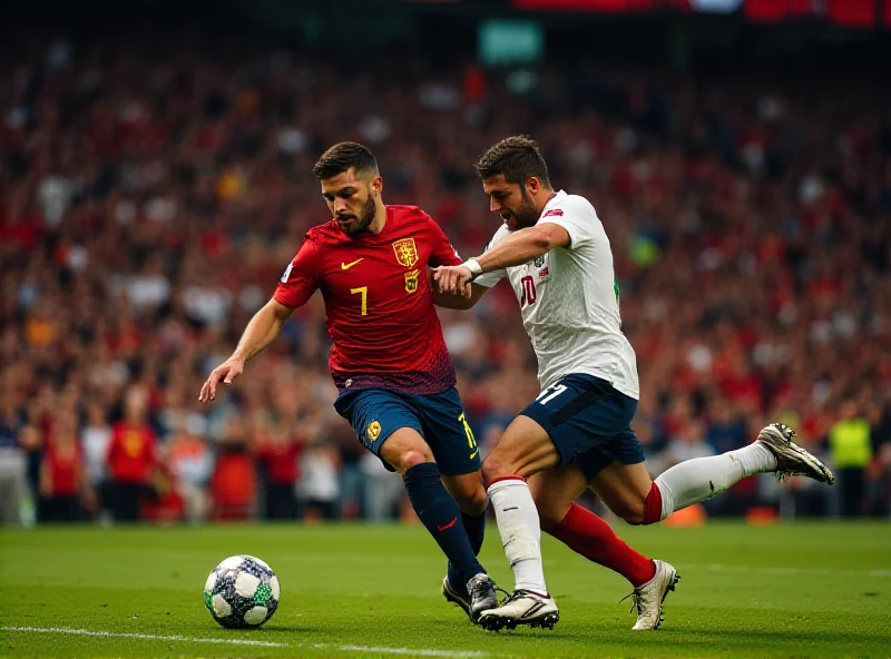 Soccer players battling for the ball during a match between England and Spain.