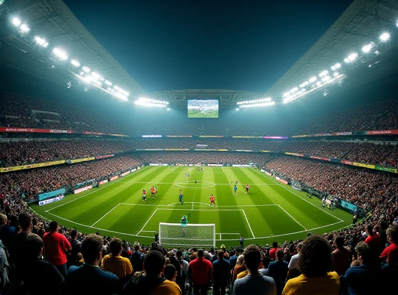 A football match in progress with players battling for the ball in a crowded stadium.