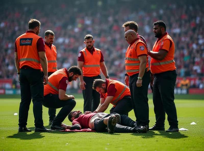 A football player lying on the ground receiving medical attention, surrounded by concerned teammates.