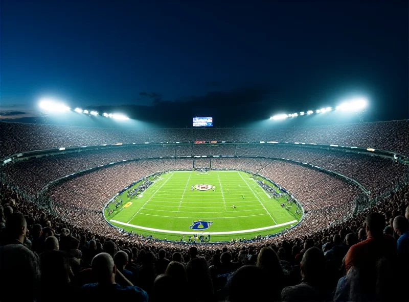 Panoramic view of a college football stadium during a night game