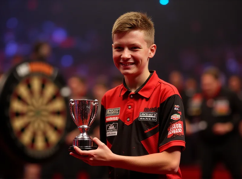 Luke Littler celebrating after winning a darts match.