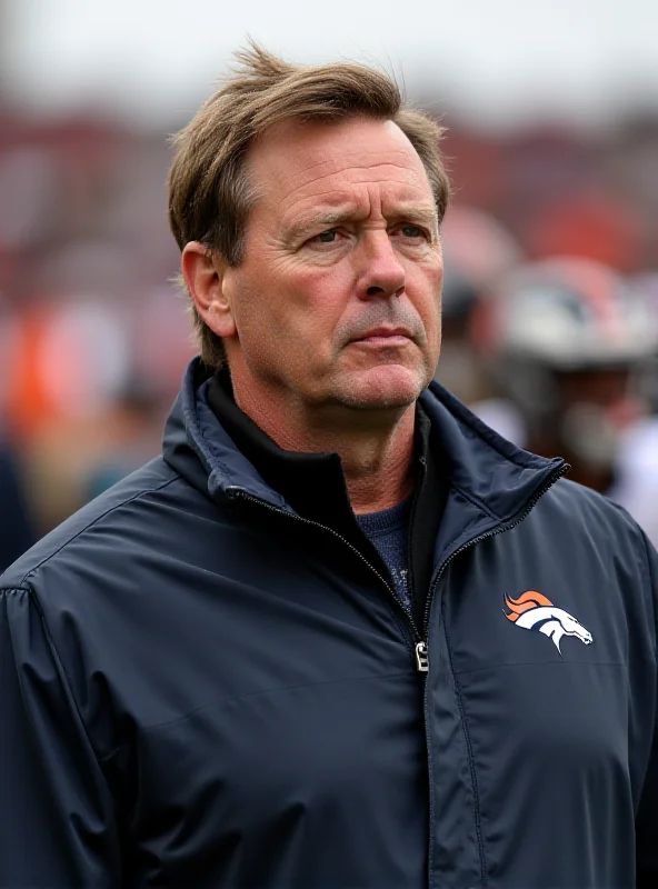 Sean Payton, head coach of the Denver Broncos, standing on the sidelines during a game.