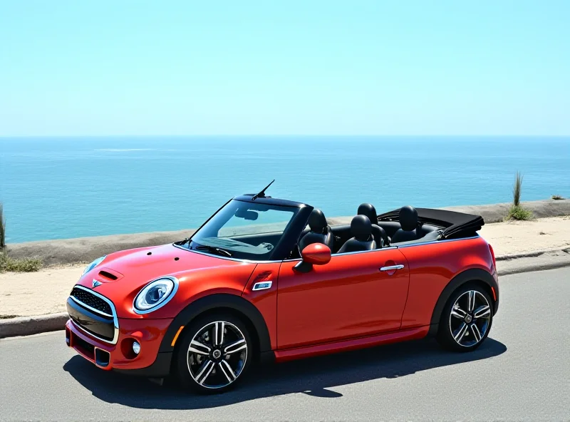 A sleek, modern Mini Cooper convertible is parked on a scenic coastal road, showcasing its exterior design with the top down. The car is a vibrant color, contrasting with the blue sea and sky in the background.