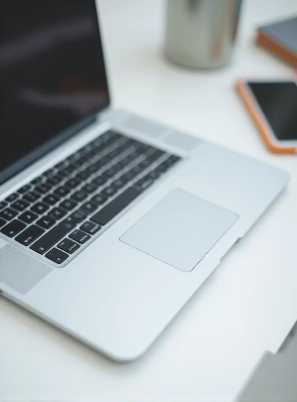 Close up of a silver M4 MacBook Air laptop on a clean white desk in a minimalist office setting