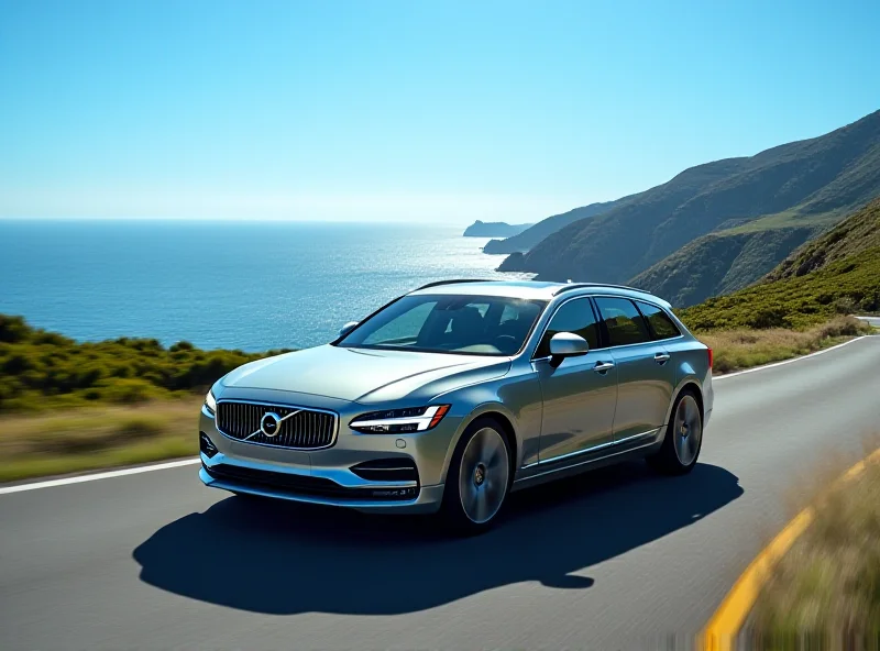 Side view of a sleek, silver Volvo ES90 EV driving on a scenic coastal road.