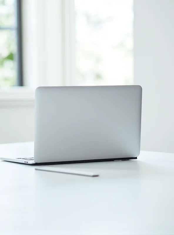 A silver M2 MacBook Air on a white table with a brightly lit window in the background.