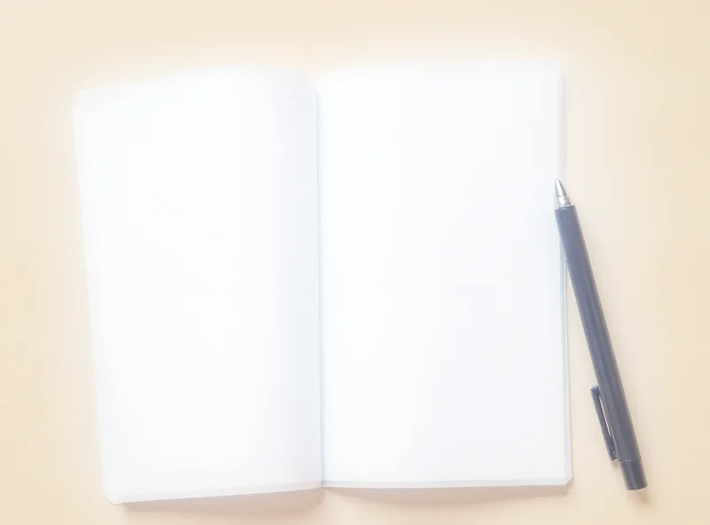 An empty notepad with a pen lying on top, symbolizing missing content.