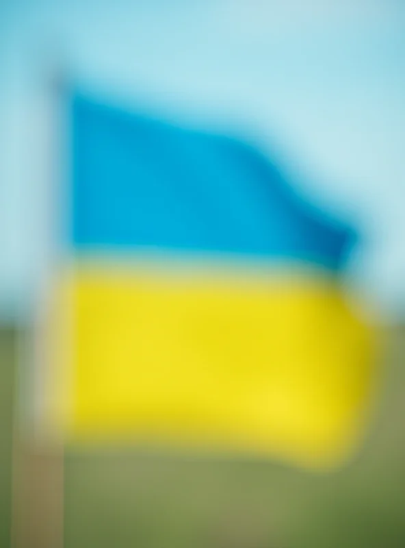 A close-up shot of a Ukrainian flag waving gently in the breeze, symbolizing the resilience and identity of the Ukrainian people.