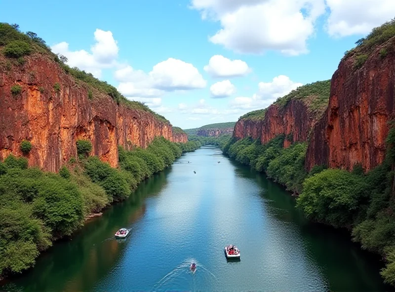 A breathtaking view of the Xingó Canyon in Brazil, with boats navigating the river between towering cliffs.