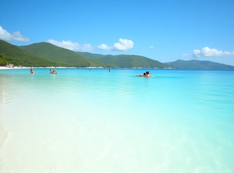 A pristine beach with crystal clear turquoise water and white sand. The sun is shining brightly, and there are a few people relaxing on the beach. In the distance, there are rolling green hills.