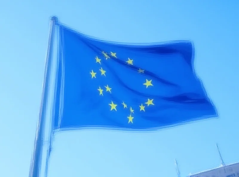 European Union flag waving in front of the European Parliament.