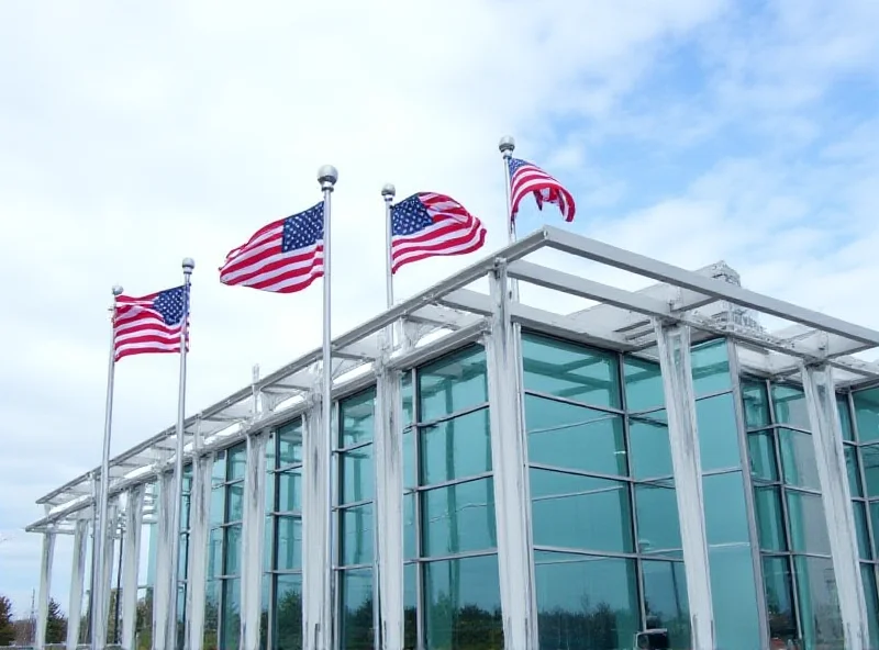 An office building with American flags waving in front.