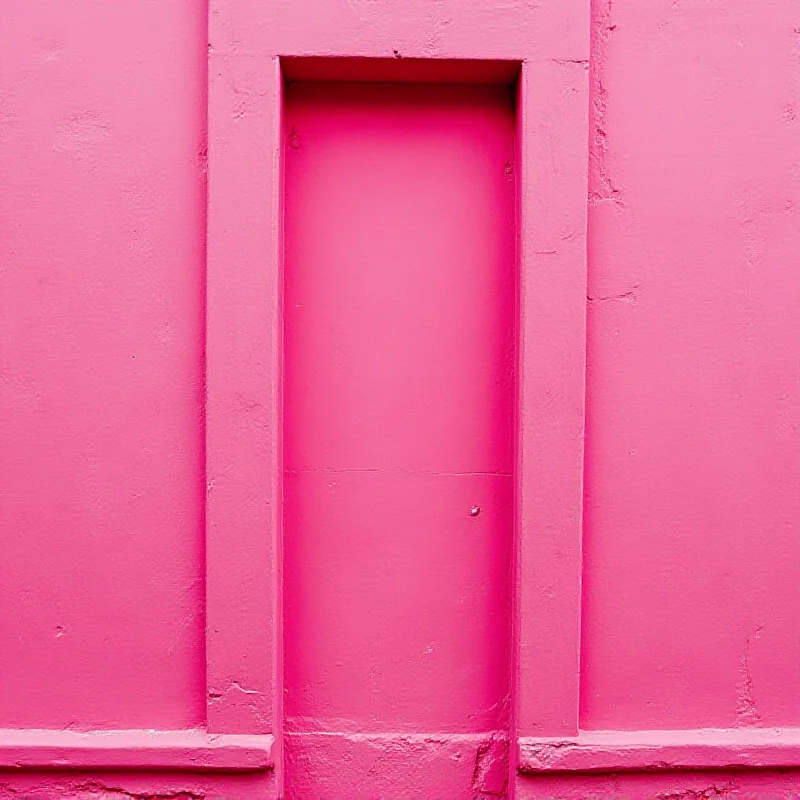 Close up of the pink building facade in Košice, showcasing the vibrant pink color and architectural details.