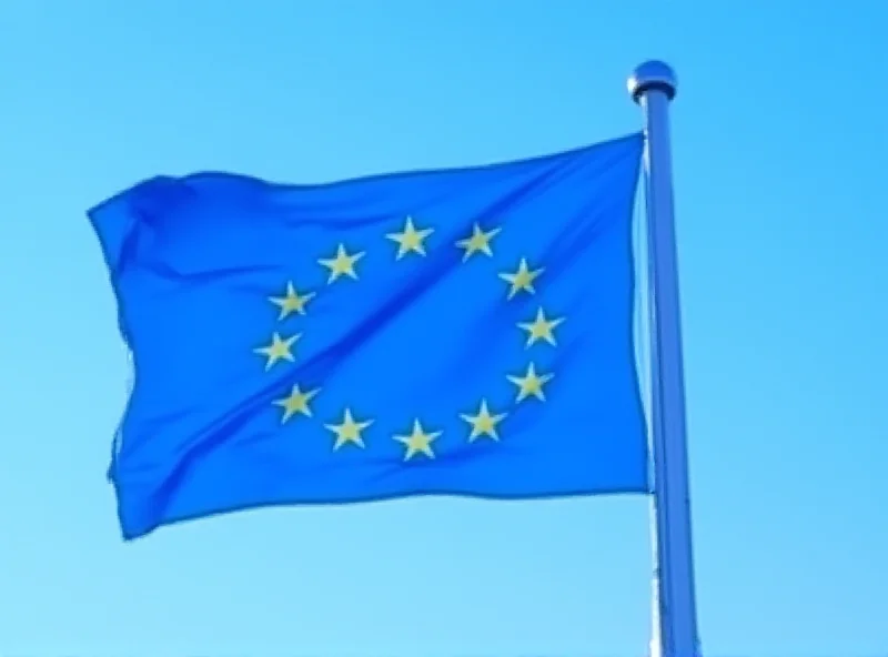 European Union flag waving in front of the EU parliament building