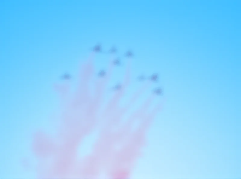 The Red Arrows flying in formation, leaving trails of red, white, and blue smoke.