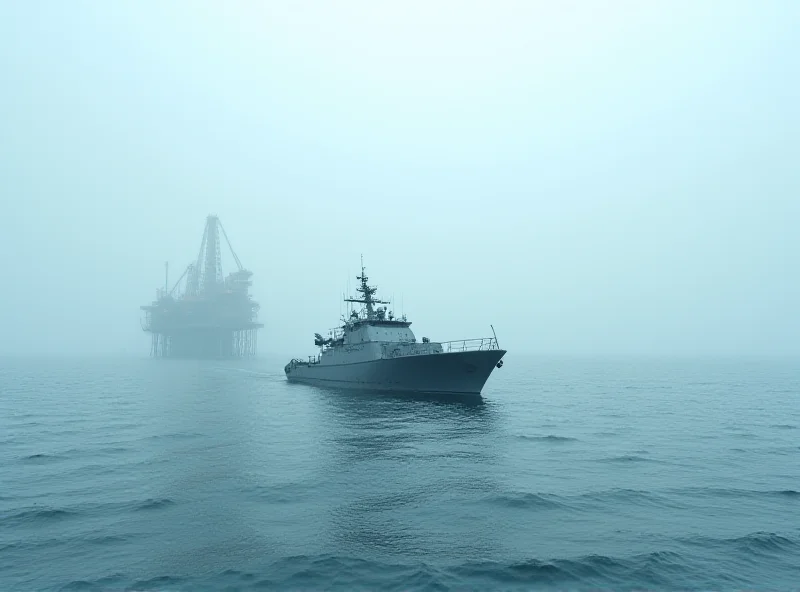 A Venezuelan naval ship sails near an oil rig in disputed waters.