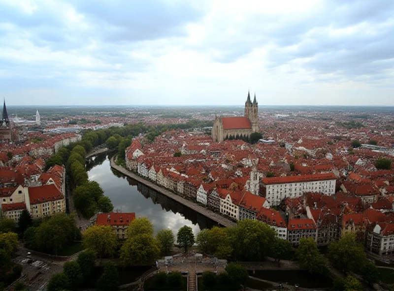 Panoramic view of Krakow, Poland, with a cloudy sky overhead.