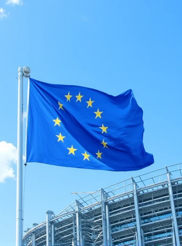 European Union flag waving in front of the European Parliament building in Brussels