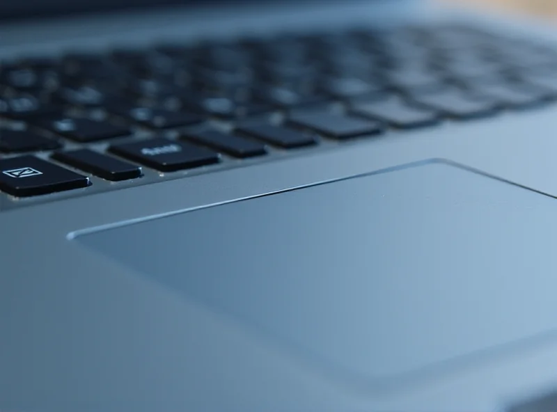 A close up shot of the keyboard and touchpad of the ASUS Zenbook A14.